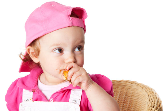 Toddler Eating a Muffin