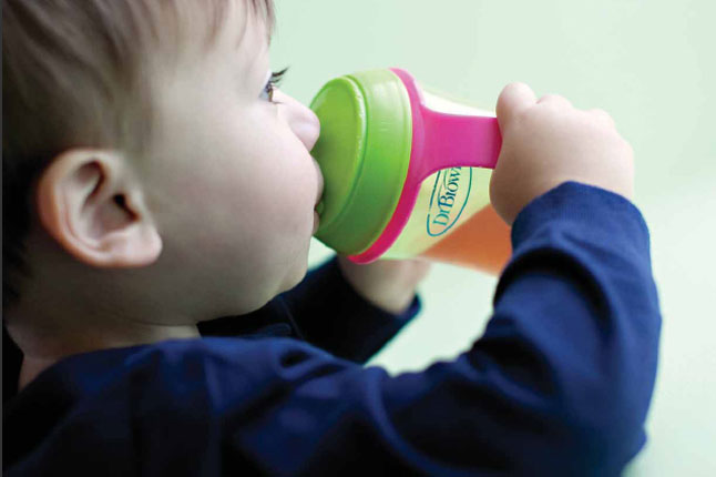 Boy drinking from Dr. Brown's Training Cup